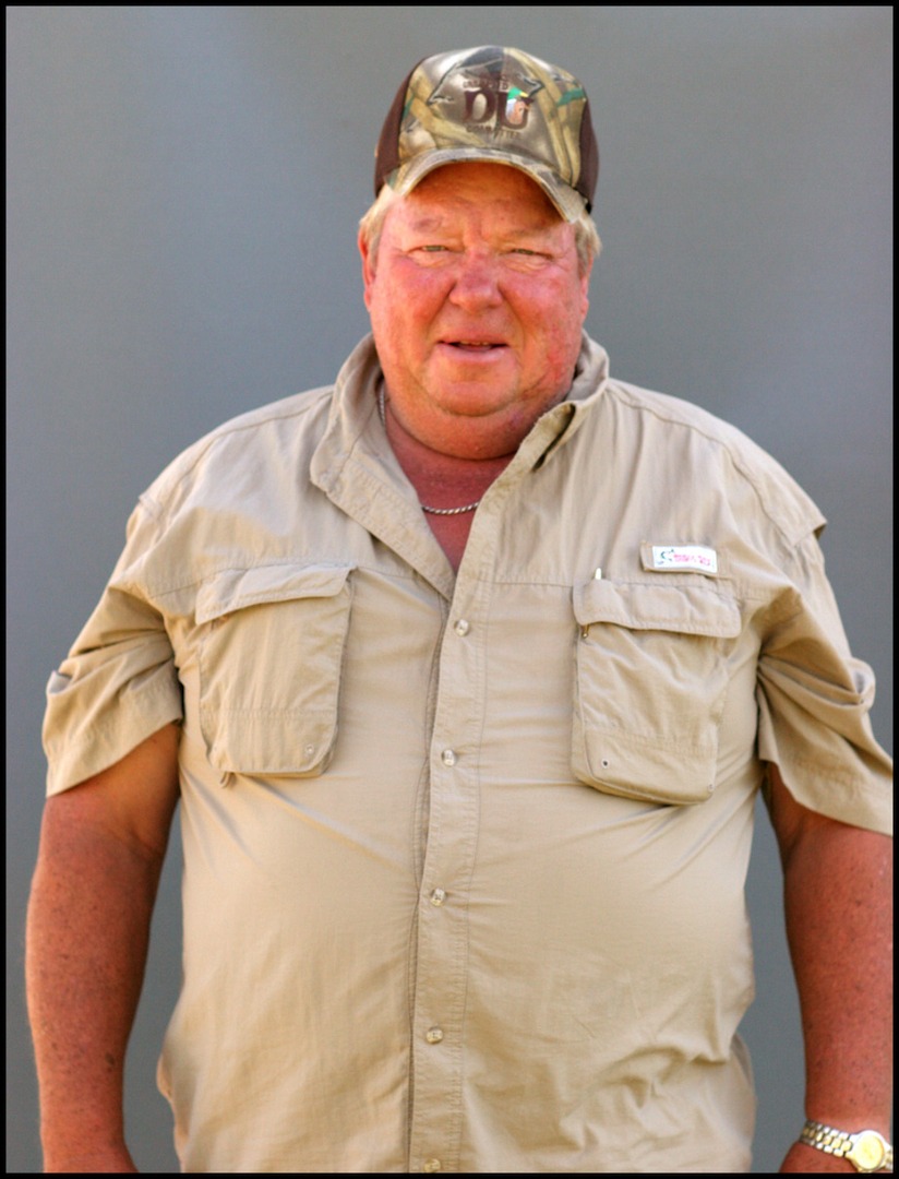 A man with brown cap