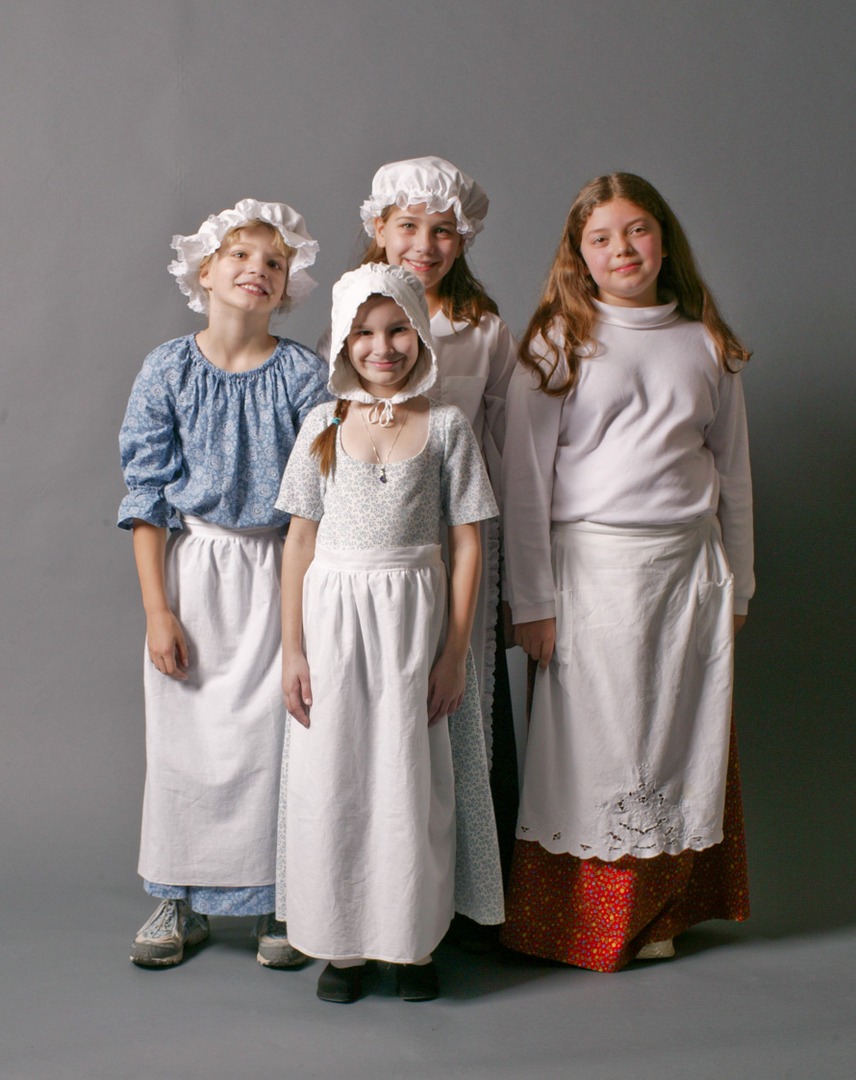 Four children wearing historical clothes