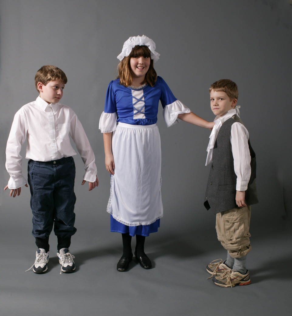 An image with a wearing a blue dress with apron in the middle