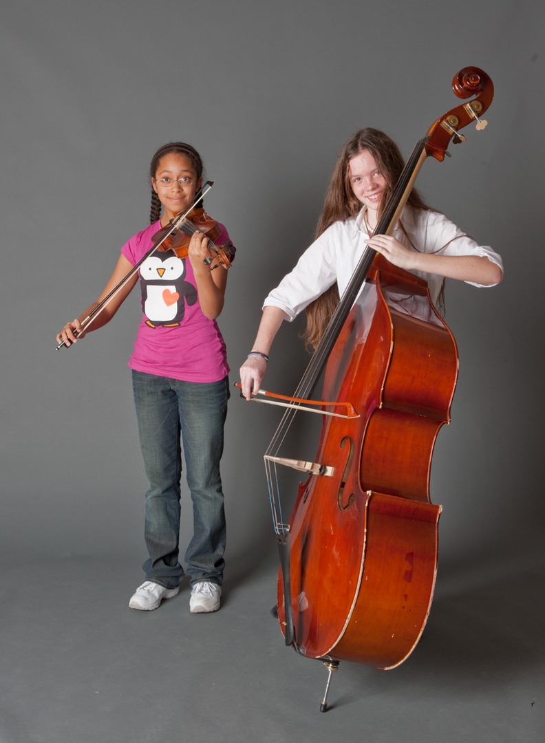 two girls with instruments