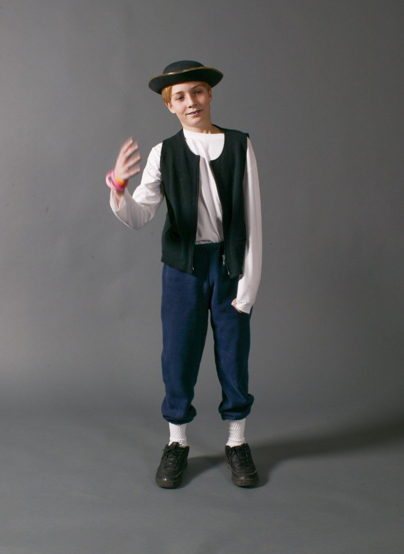 A boy wearing a white long sleeves