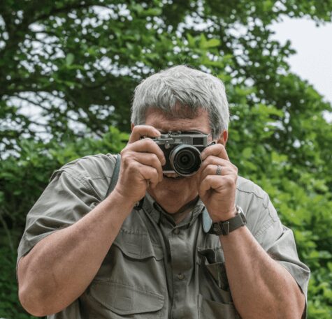 a man holding a camera