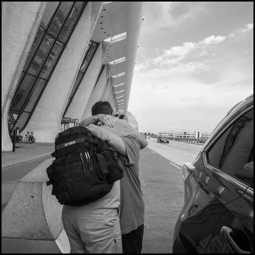 two people hugging each other