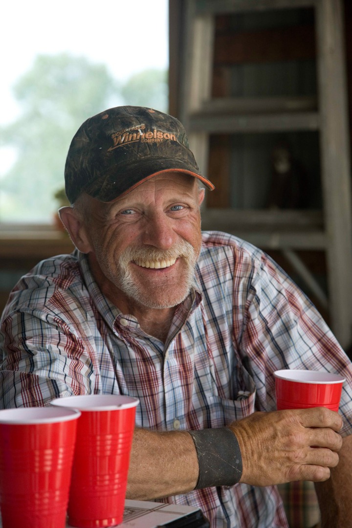 A man holding a red cup