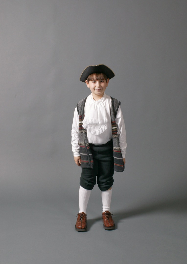 A solo image of a boy wearing historical clothes