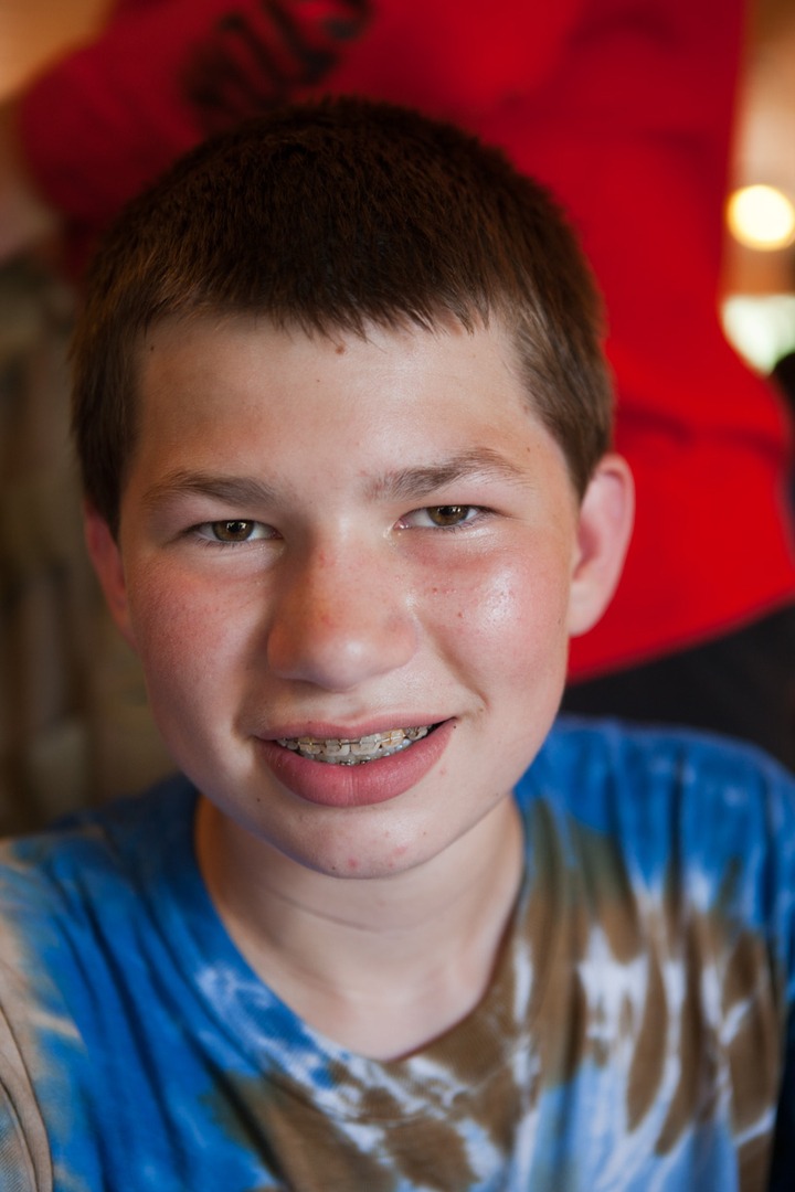 A boy with braces smiling