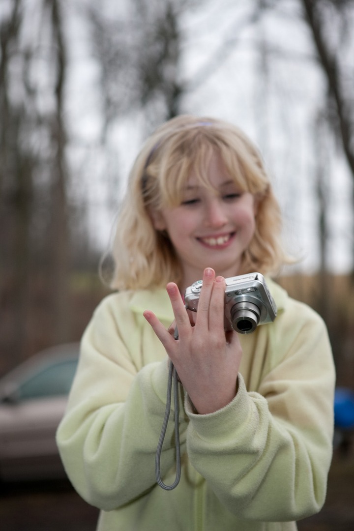 A girl holding a camera