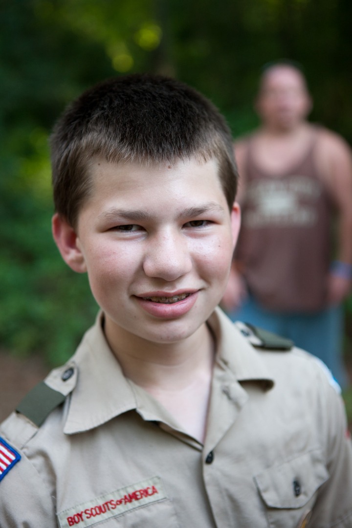 A boy smiling in a uniform